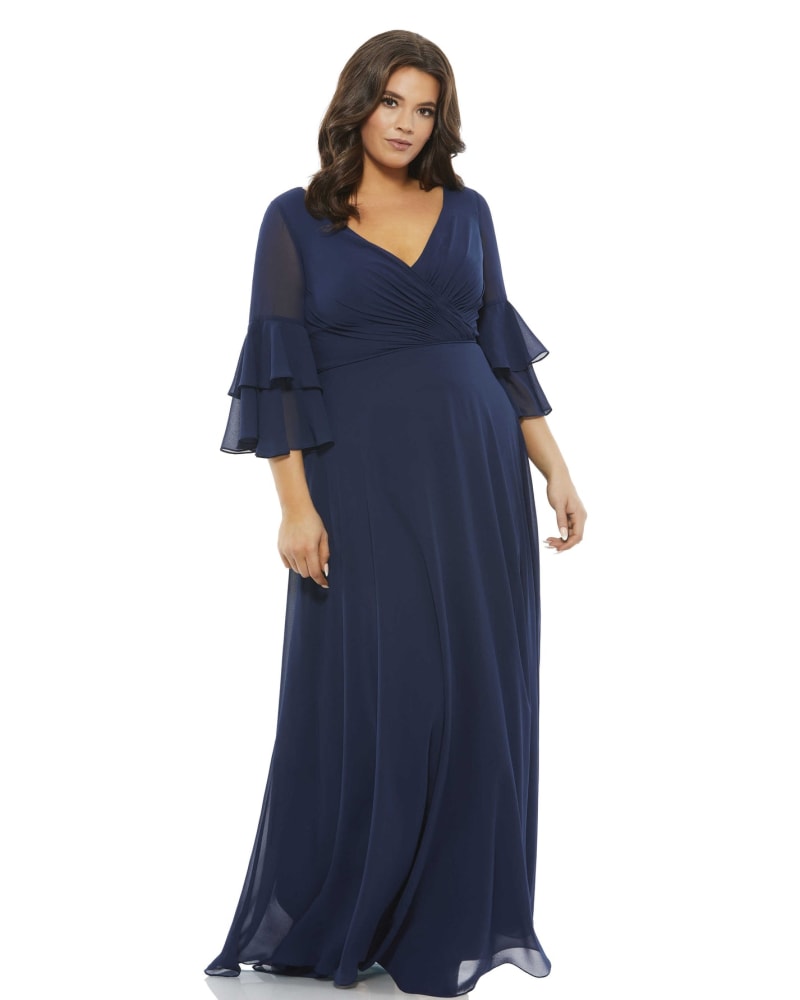Front of a model wearing a size 14W Pleated Bell Sleeve Chiffon Gown in Navy by Mac Duggal. | dia_product_style_image_id:290010
